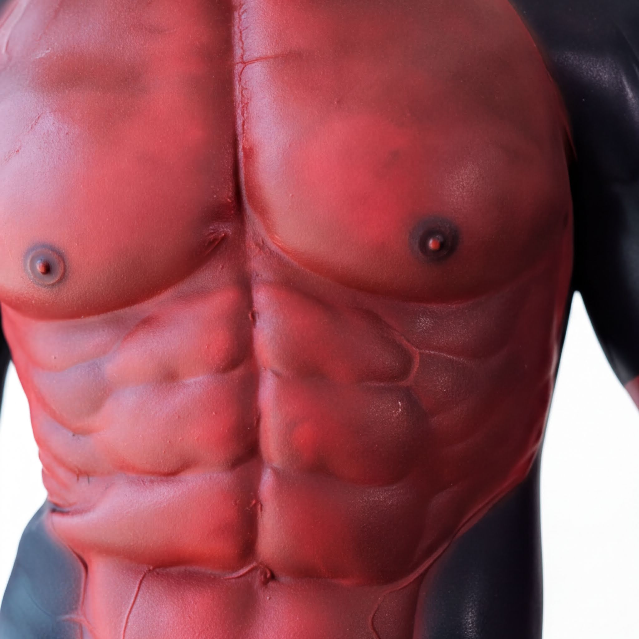 A close-up of a muscular torso, with a red and black color scheme.