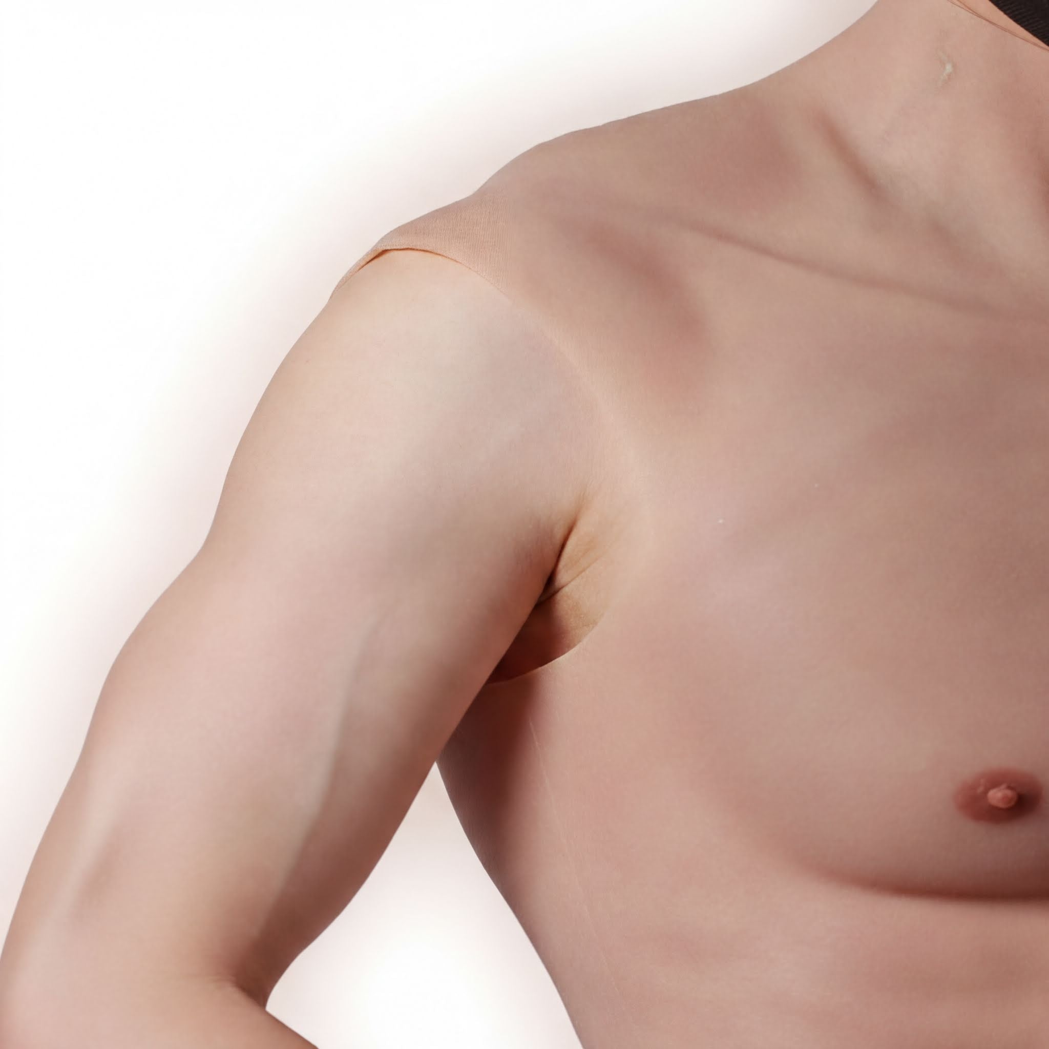 a close-up view of a person's upper body, focusing on the shoulder and chest area.