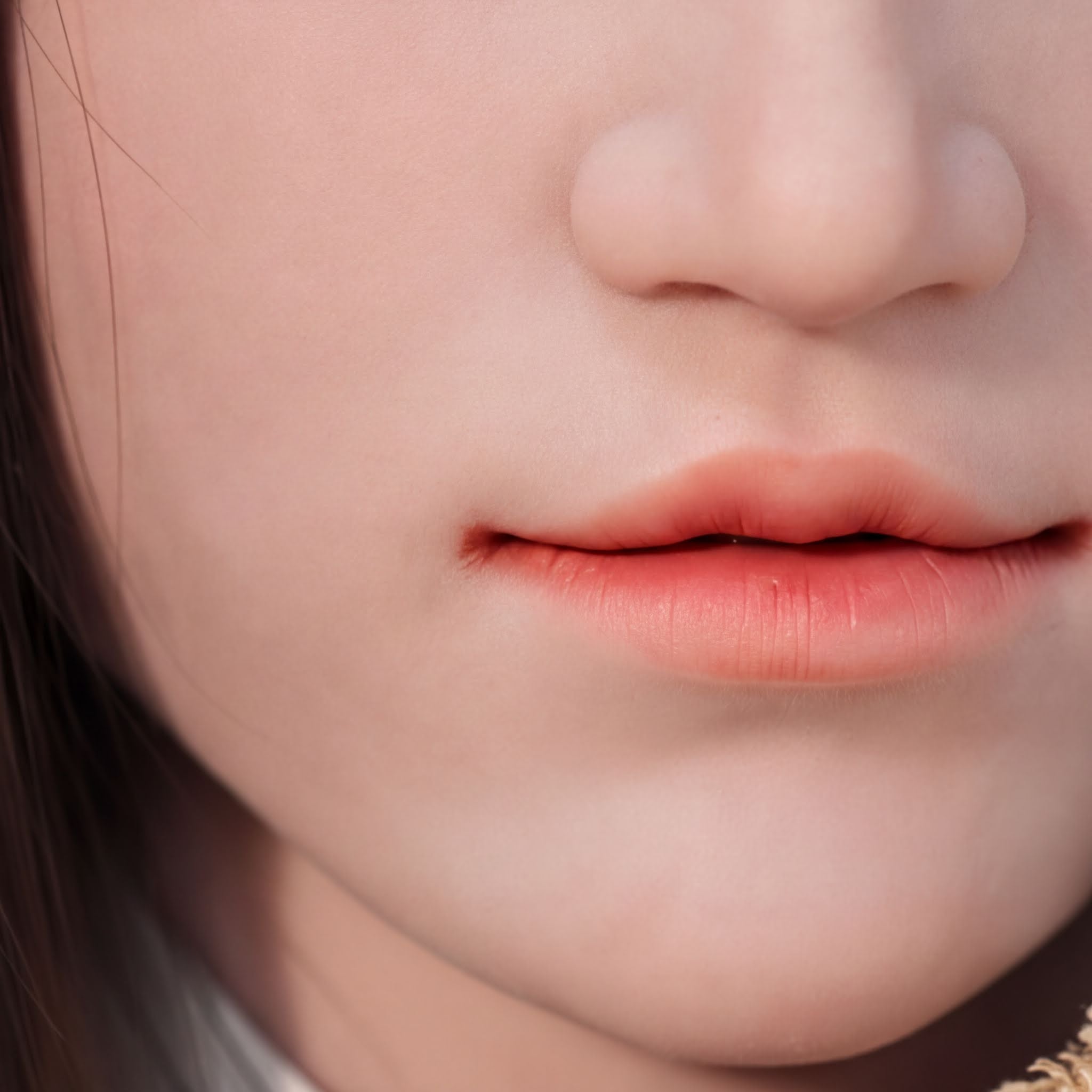 A close-up of a person's face, focusing on their lips and nose.