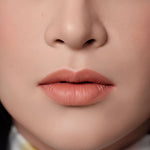 A close-up of a person's face, focusing on their lips and nose.
